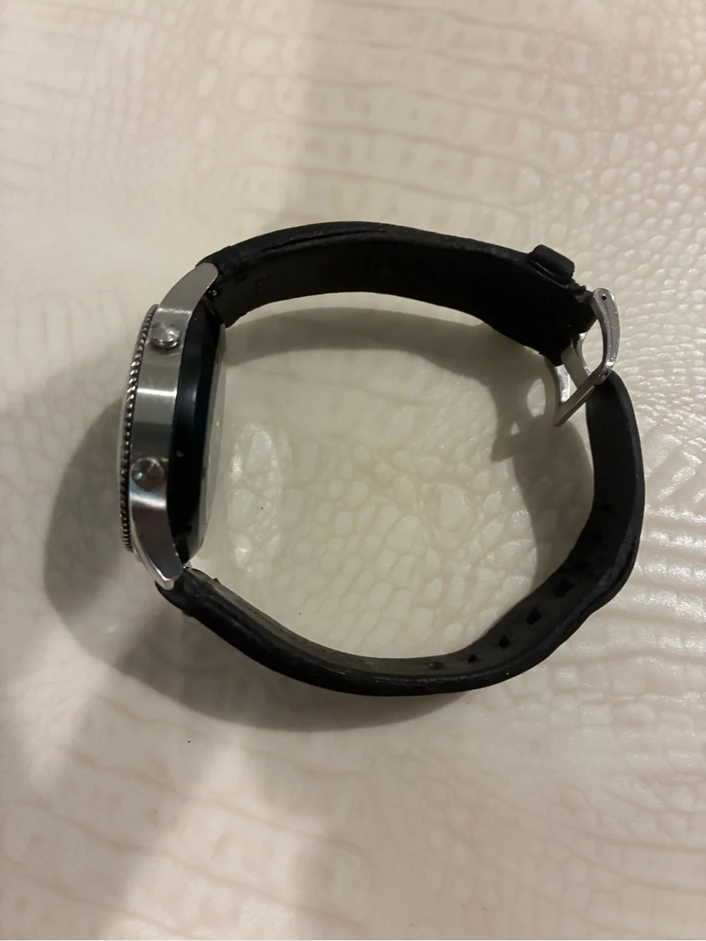 Samsung Silver Smartwatch with Black Strap and Blue Display